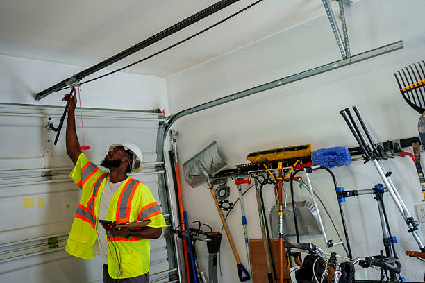 Professional Garage Door Panel Replacement technician working in Franklin County County, ME